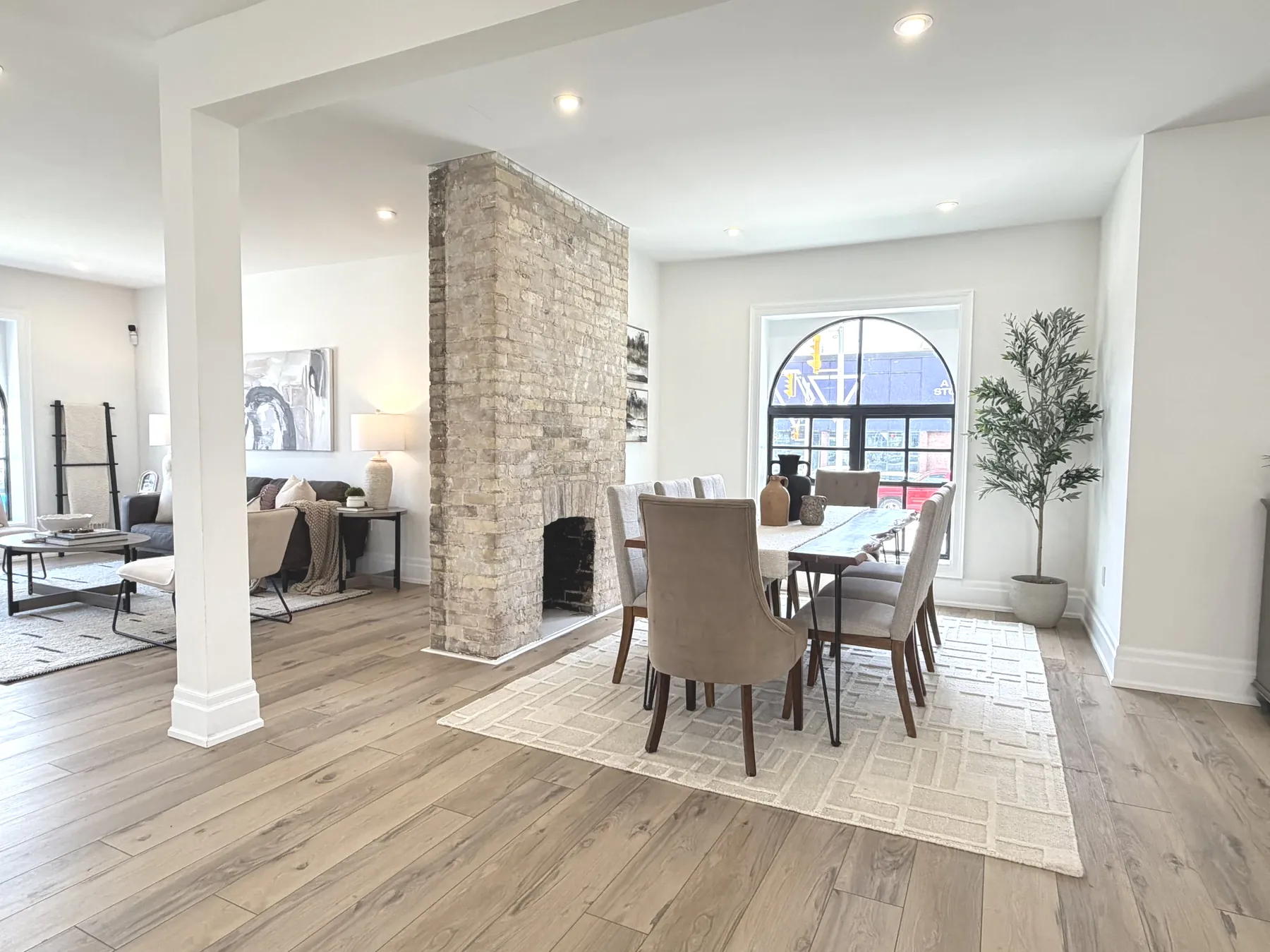 Dining vignette beside the brick fireplace in The Beacon