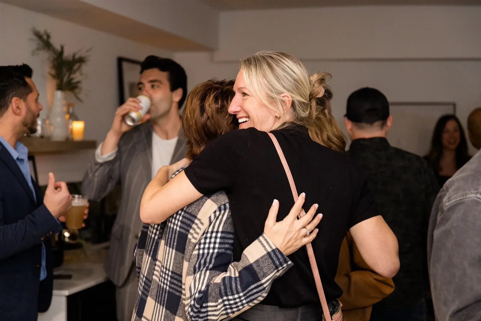 Guests mingling at a Lumen House open house event