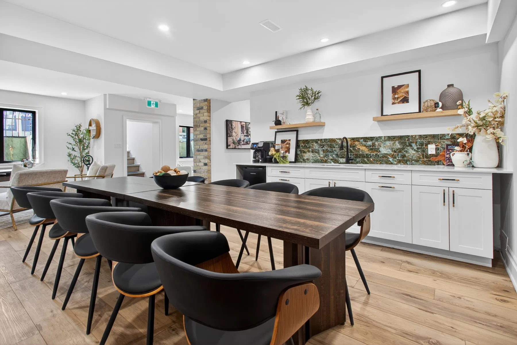 The Vault's harvest table with seating for twelve beside the kitchenette